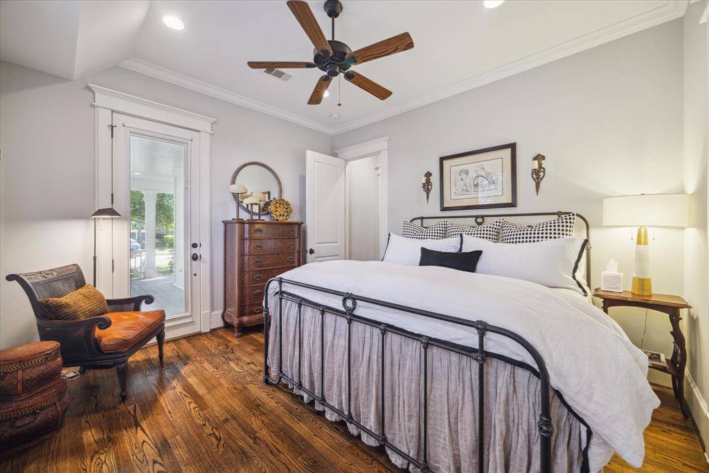 The first floor guest suite is grounded by rich oak floors and detailed trimwork.  A door leads directly to the front porch allowing guests to come and go.