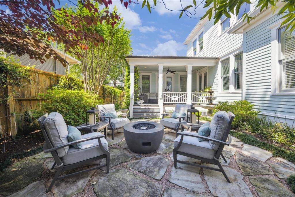Climbing vines, flowering shrubs, and a tiered fountain add to the charm of the yard.  A mosquito control system keep the bugs at bay.