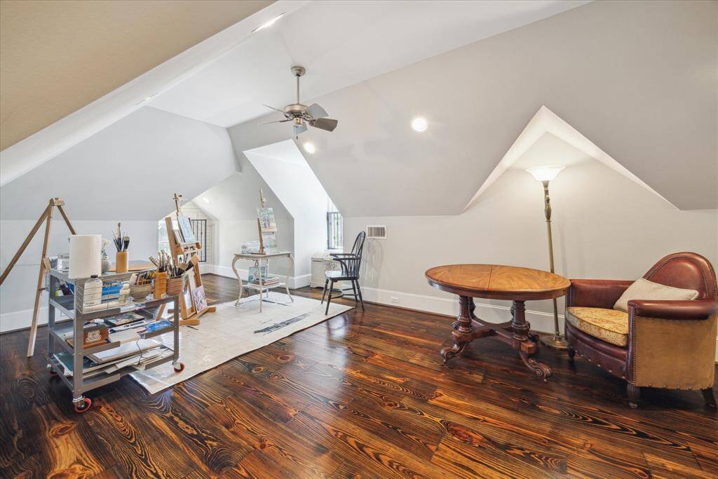 Whether you're painting, writing, reading, or or just dreaming, this second floor flex space sparks inspiration. Architectural cutouts and angled ceilings give it gallery-like presence, while natural light filters through perfectly placed dormers. Use it as an art studio, yoga loft, library, or media retreat—the design potential is endless.