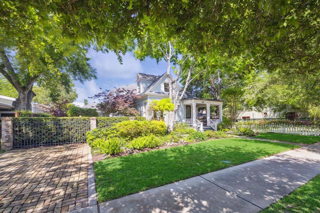 This block of Rutland has a wide, curbed street with underground sewer.  The sidewalk in front of the home is also generously wide.   Note the additional parking that was thoughtfully planned as part of the landscape design.  Alley access in the back of house.