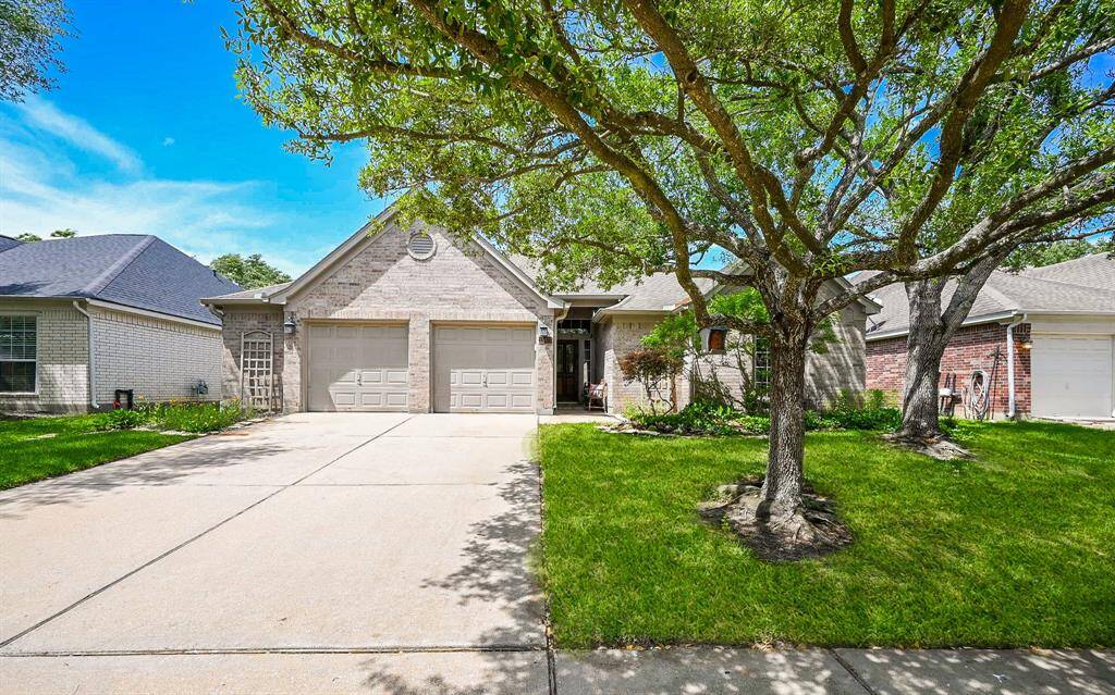 Welcome HOME to 15423 Coral Leaf Trail.