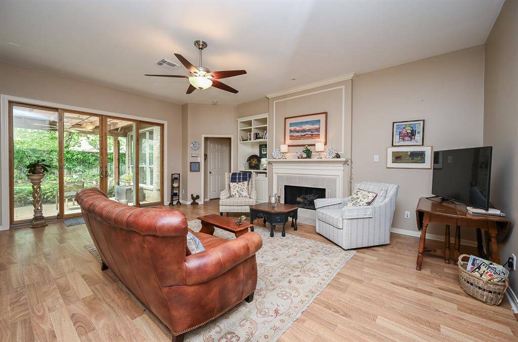 Oversized Anderson 4-panel sliding doors create a stunning transition from the indoor living space to the backyard retreat.