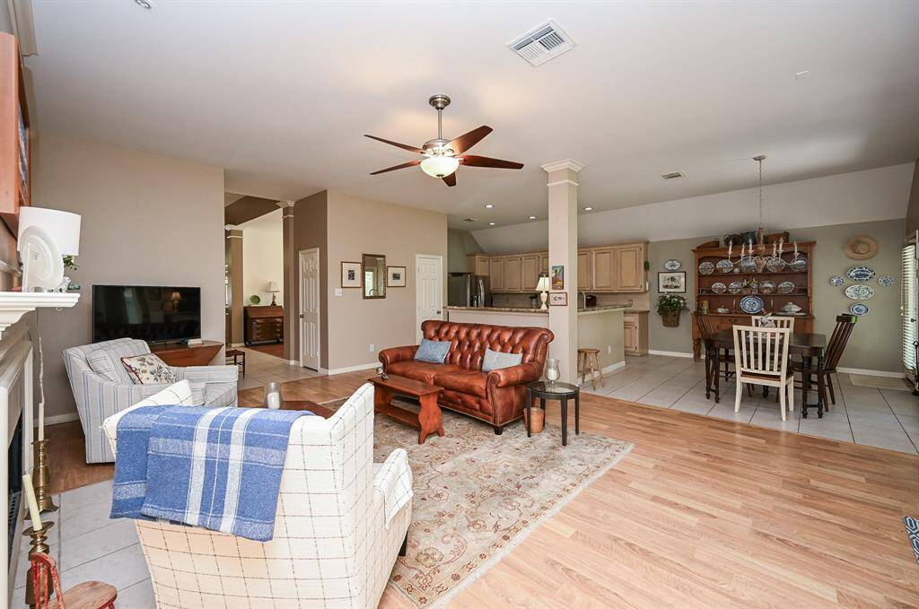 The layout connects effortlessly with the kitchen and dining room, allowing for easy flow and interaction—perfect for gatherings or quiet evenings at home.