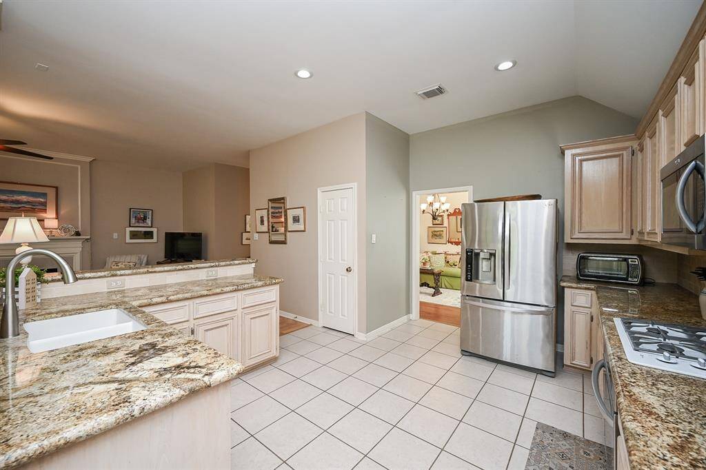 This perspective showcases the kitchen's connectivity to the living area.