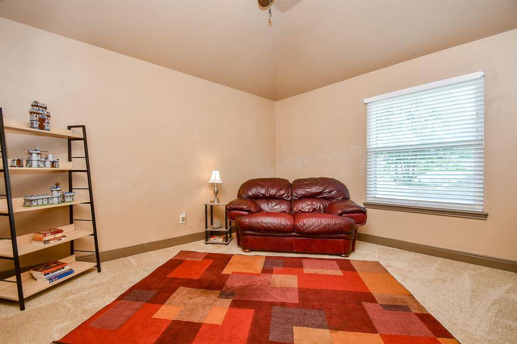 Another comfy bedroom offering lots of natural light.