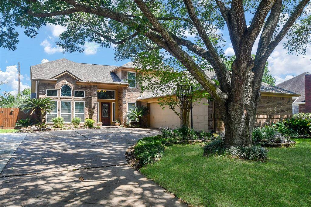 Welcome Home to 1602 Pecan Crossing! Spacious Driveway, Beautiful Trees and a Three Car Garage!