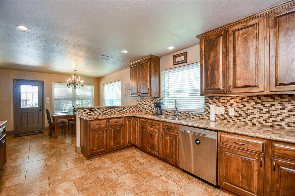 Kitchen is updated with granite countertops and has ample cabinet and counter space!