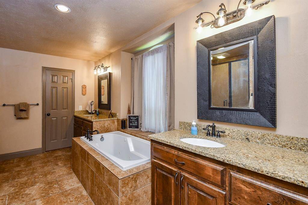 Double Sinks with Designer Mirrors and Fixtures