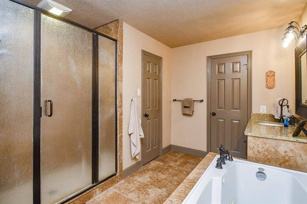 Expansive, separate shower in the primary bathroom.
