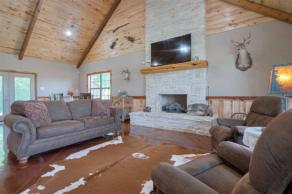 Take in the breathtaking details with the stone fireplace and all of the custom woodwork!