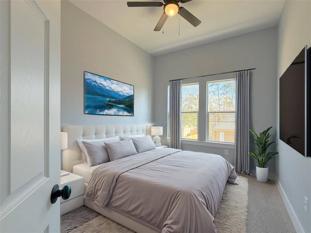 Luxurious master suite featuring a stunning bath and spacious walk-in closet. Staged