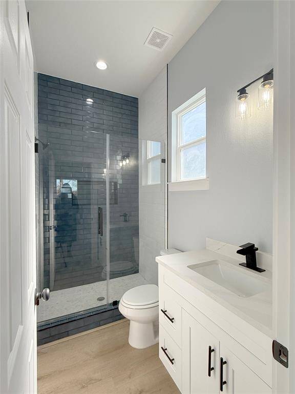 Luxurious bathroom featuring a sleek glass shower, Soap Niche, Tile to ceiling and exquisite details for an exceptional experience.