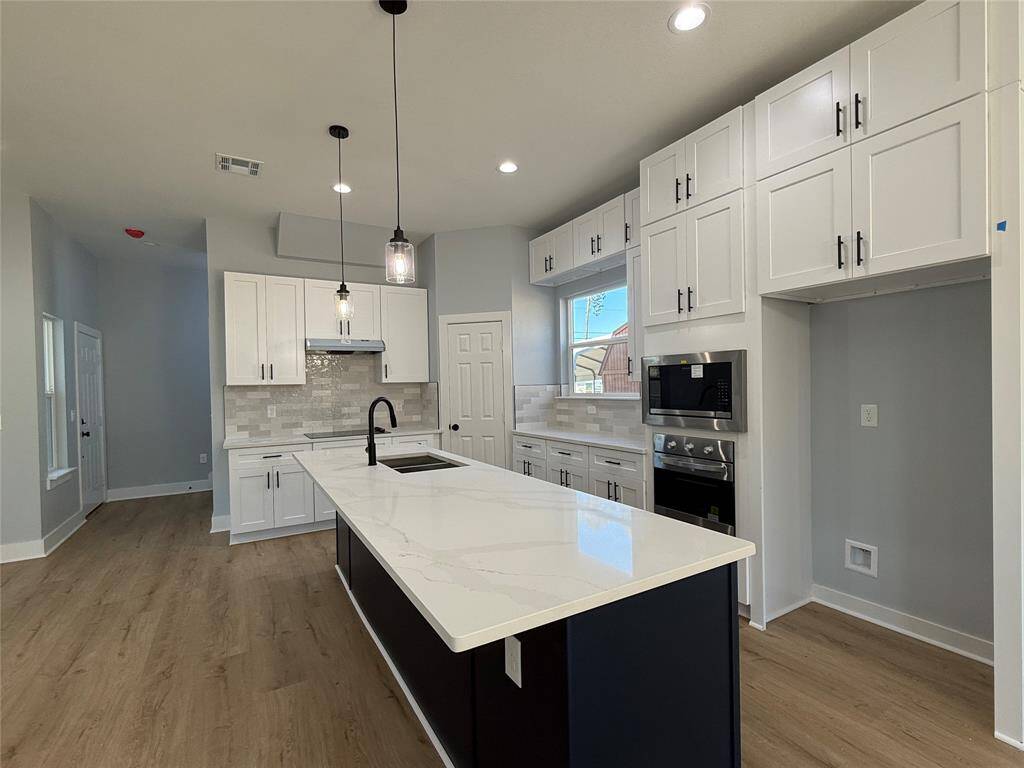 Modern Dream Kitchen featuring an expansive Quartz Island!