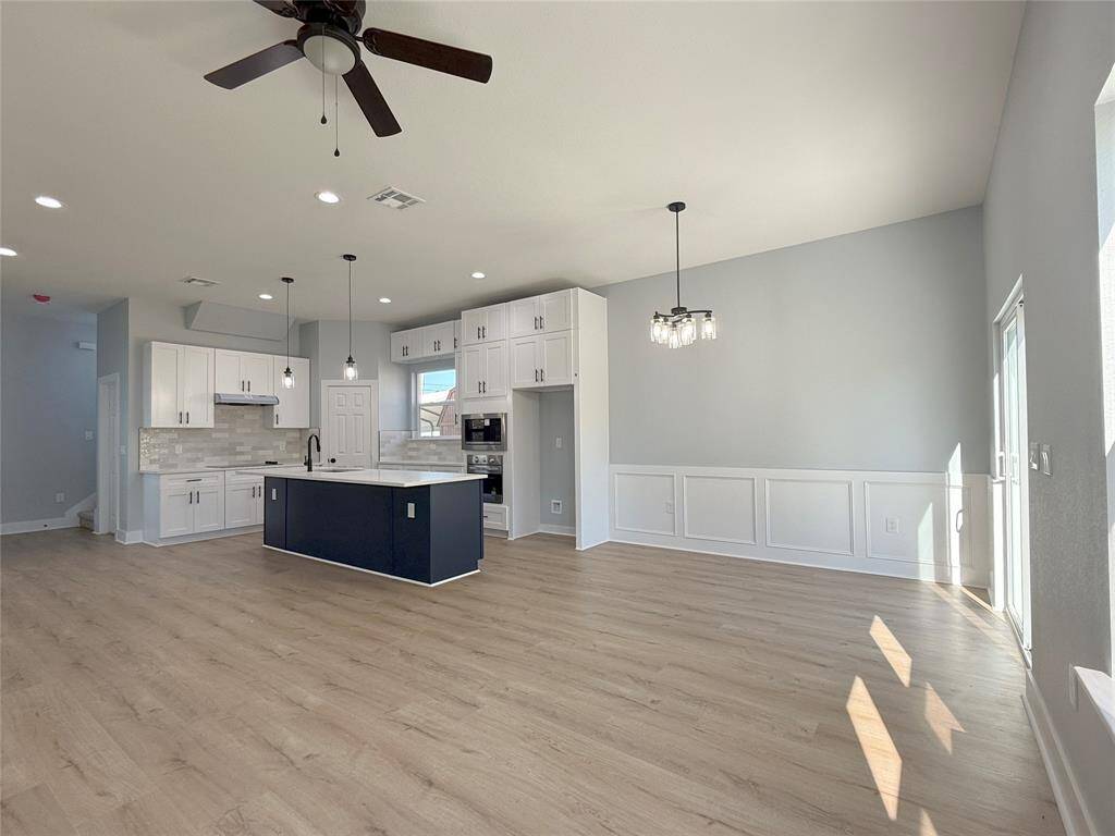 Elegant Formal Dining, Spacious Living Area, and Cozy Breakfast Nook seamlessly connected in an open-concept floor plan!