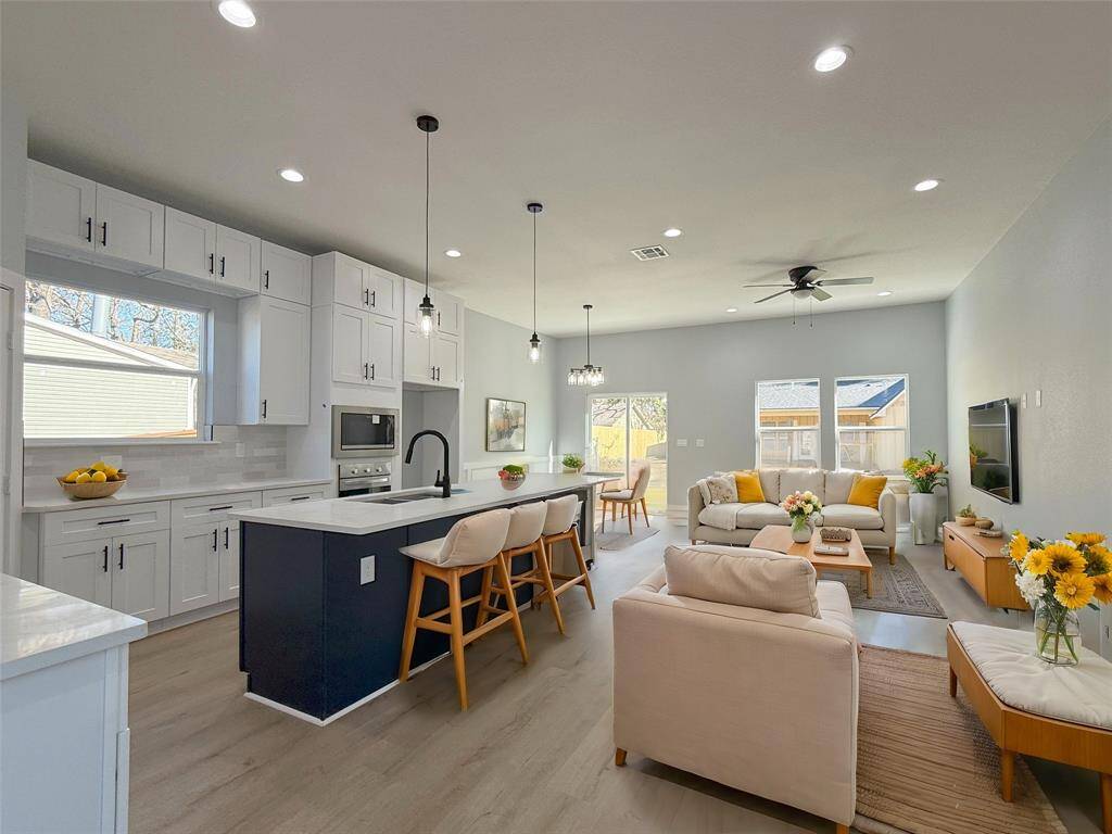 Formal Dining, Bright Living Area, and Casual Breakfast Space seamlessly blended in an open-concept design! Staged
