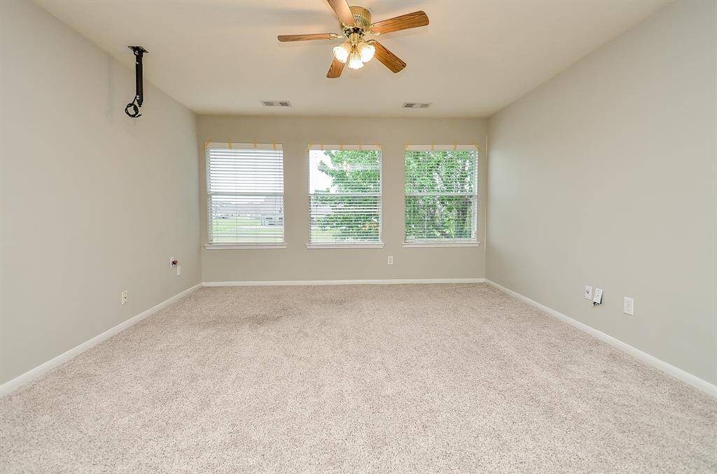 Spacious game room with water view.