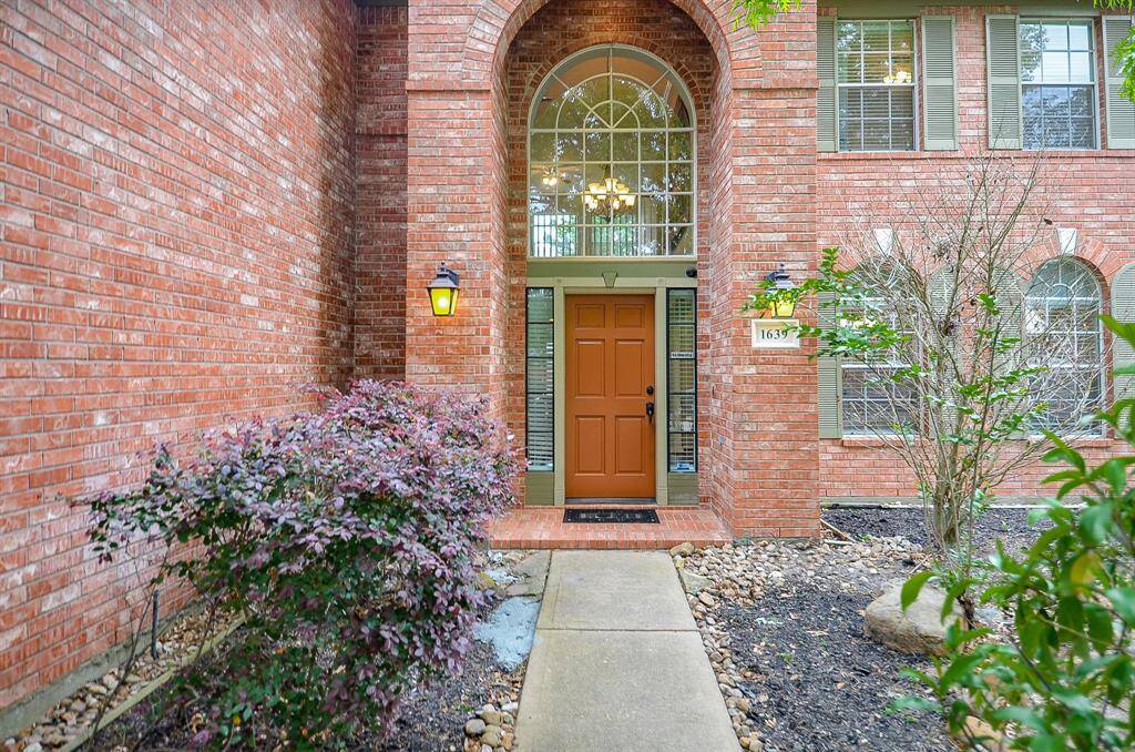 Beautiful Landscaping, meets a Soaring Entry.