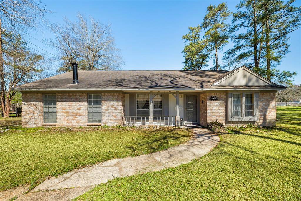 Charming single-story brick home with a welcoming front porch, large windows, and a spacious, well-maintained lawn. Ideal for those seeking a cozy, inviting atmosphere.