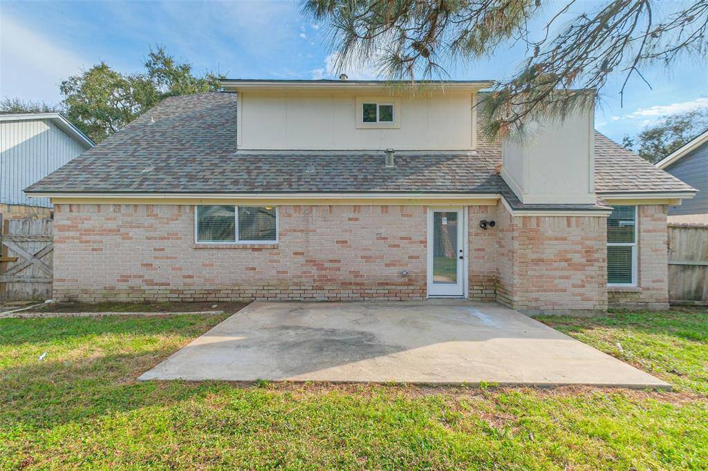 Fully fenced in backyard with concrete slab to create your own back yard oasis