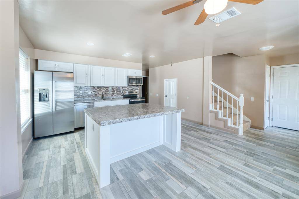 The oversized island is perfect for entertaining and gathering around.