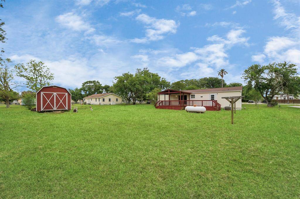 16711 Sandy Meadow -view from the back fence- plenty of room for children, pets, and gatherings.
