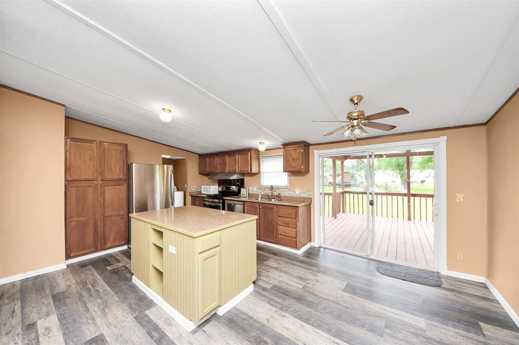 Kitchen window over the sink gives a perfect view of the massive back yard.