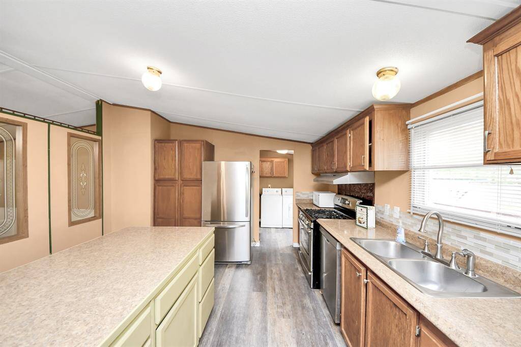 There is a lot of natural light, Utility room is off the kitchen with a private entry from the back patio.