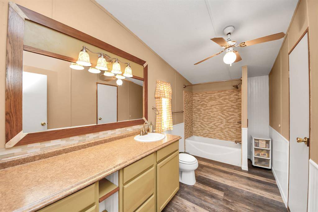 Ensuite bathroom has plenty of room to move with additional linen storage closet