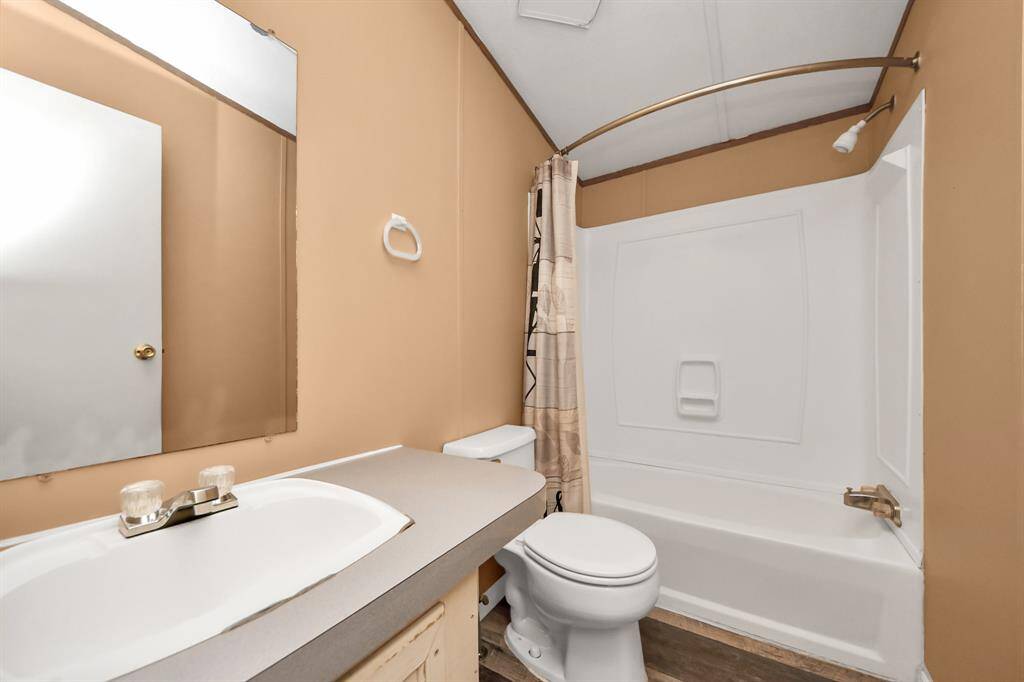 Guest bath is located between bedrooms 2 and 3, just off the living room