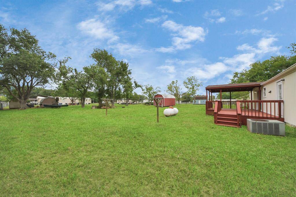 Final view of back yard, the propane tank was just filled for you and the A/C unit is new!