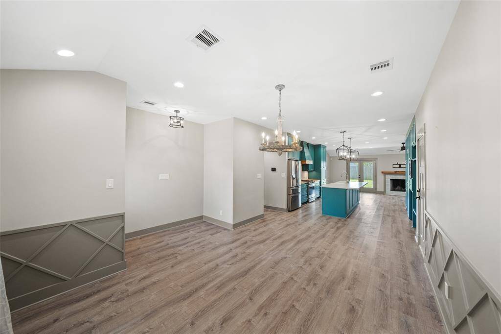 As you enter you are immediately drawn to the detailed wainscoting in the dining room.
