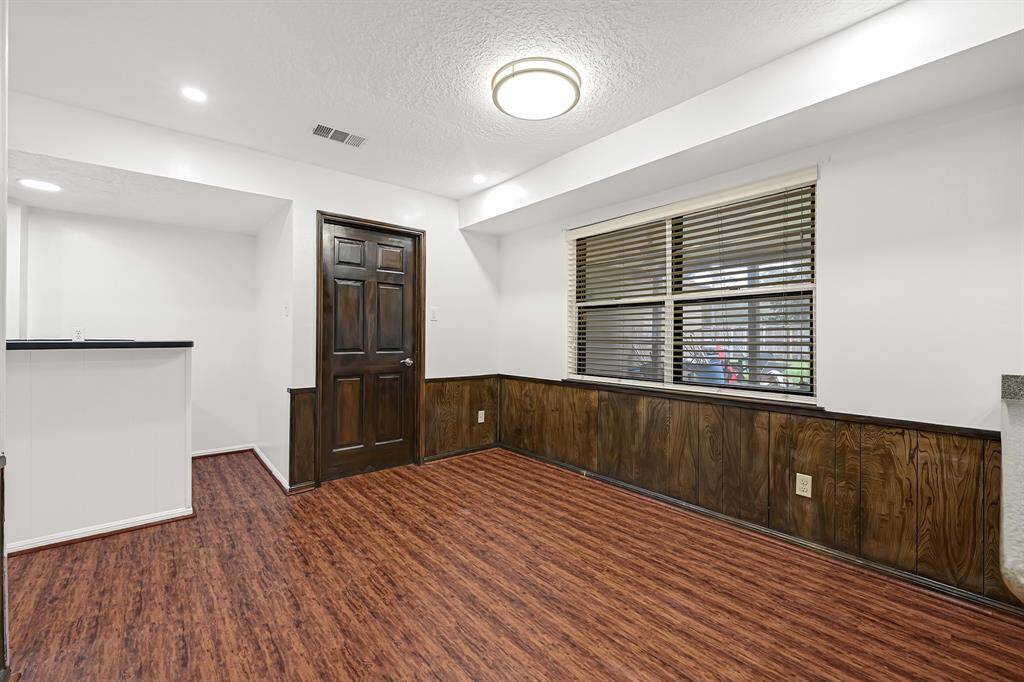 View of the formal dining and entrance to the wet bar.
