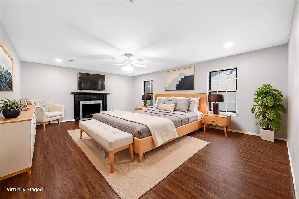 Virtual Staged: The primary bedroom has its own cozy fireplace as well as en-suite bath.