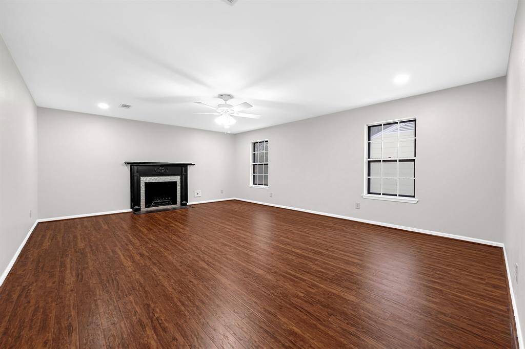 The primary bedroom has its own cozy fireplace as well as en-suite bath.