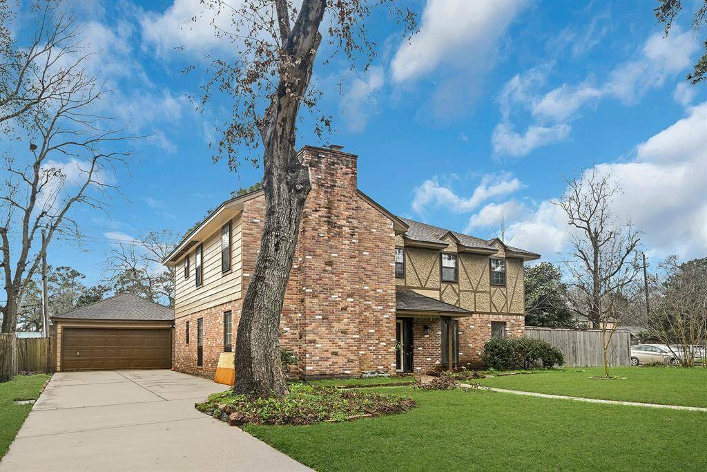 2 car garage with a long private driveway.