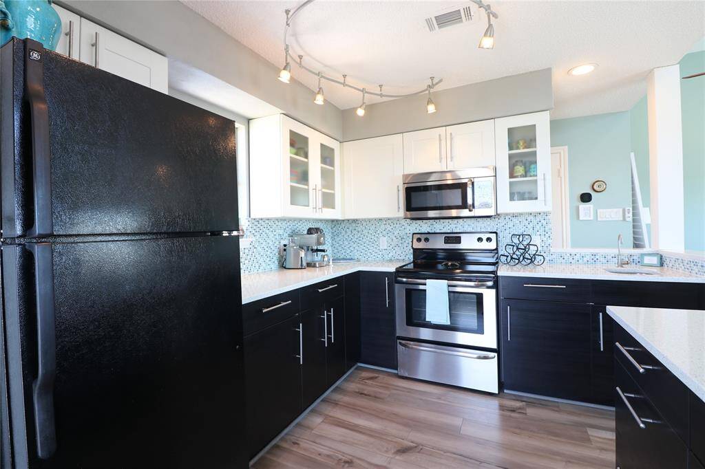 Full kitchen with ample storage.