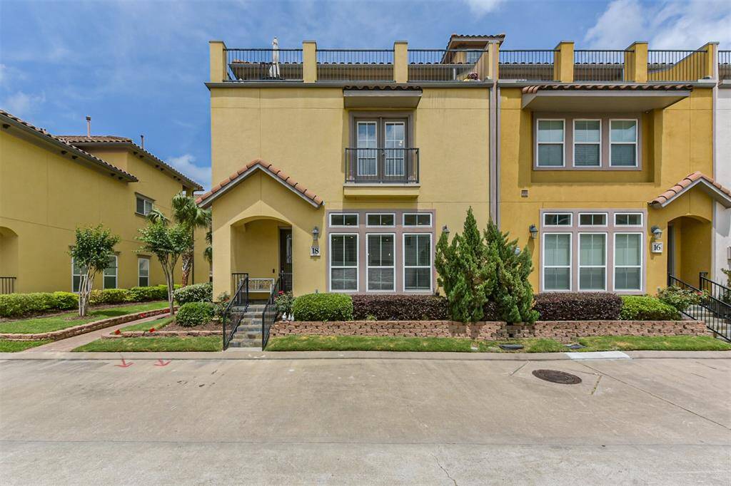 Stunning corner townhome located in a gated and waterfront community