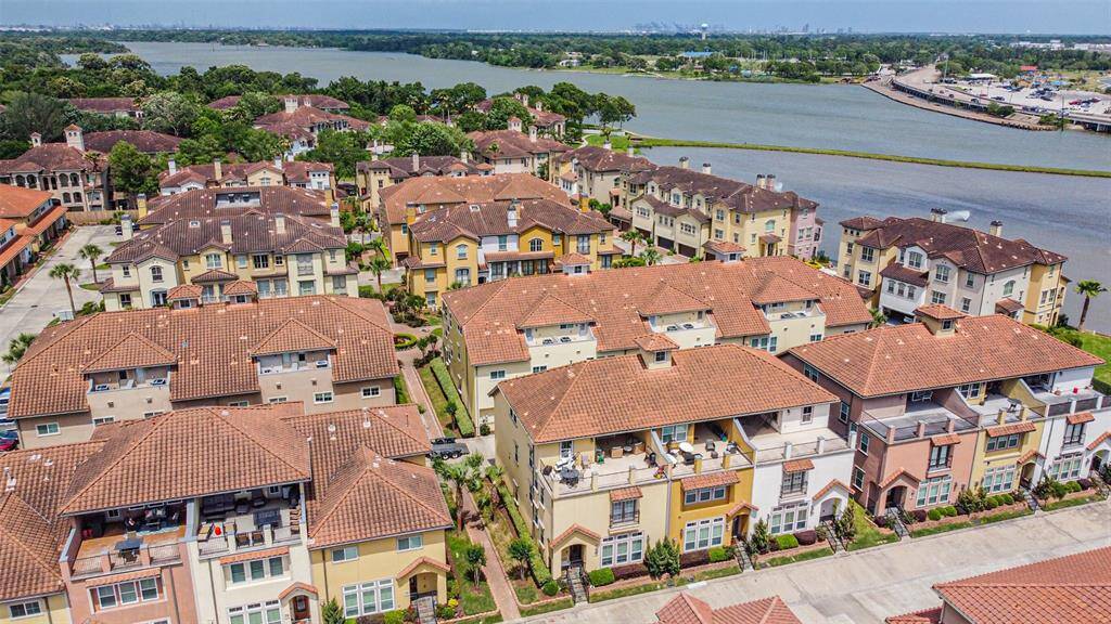 Stunning corner townhome located in a gated and waterfront community