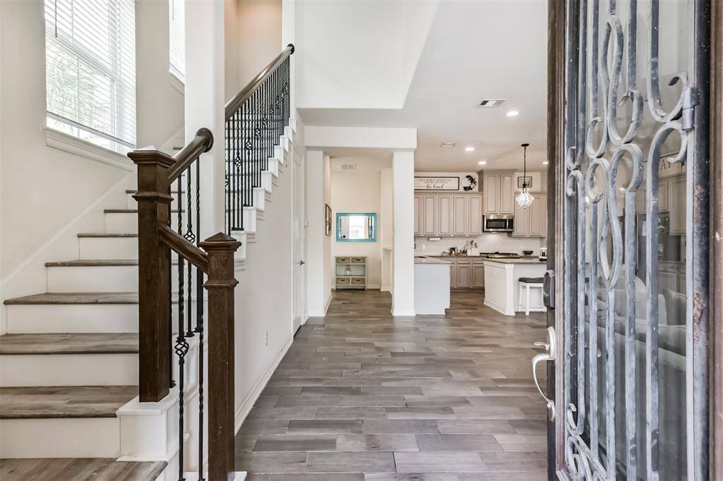 Enter to high ceilings and an open concept floor plan