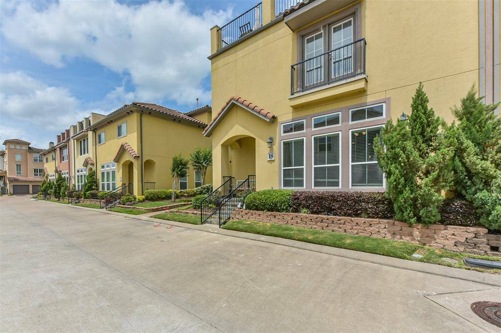 Stunning corner townhome located in a gated and waterfront community