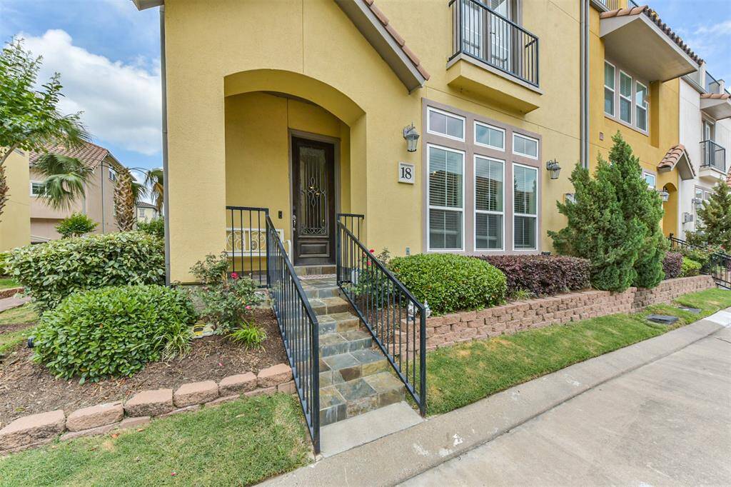 Stunning corner townhome located in a gated and waterfront community