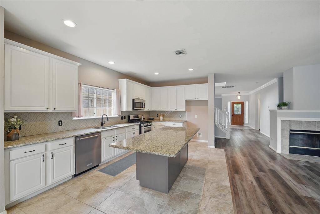The kitchen boasts endless counter space and granite countertops.