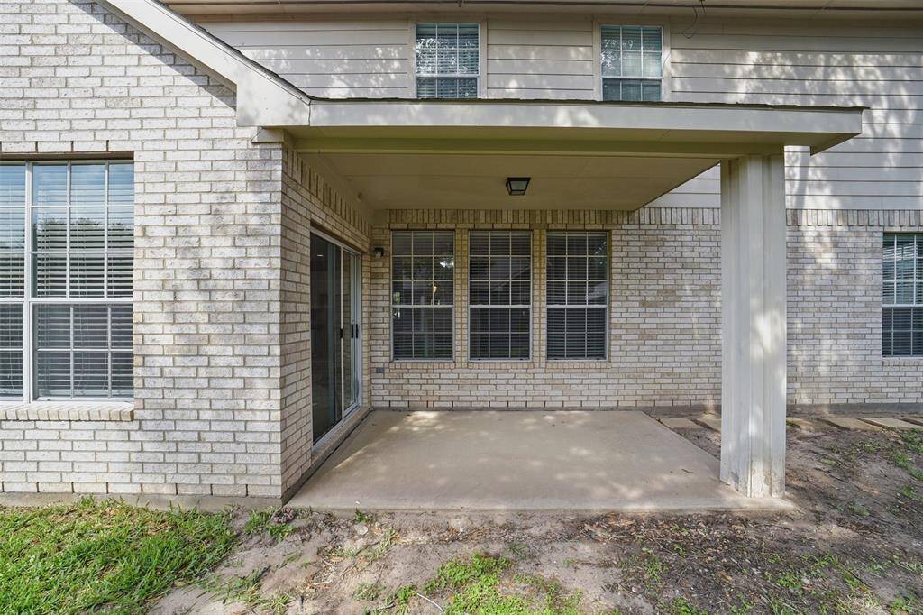 Sliding doors from the breakfast area lead to a covered patio.