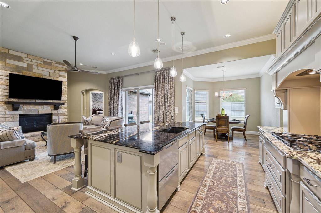 look at the gorgeous large plank wood flooring in the living areas and primary bedroom.
