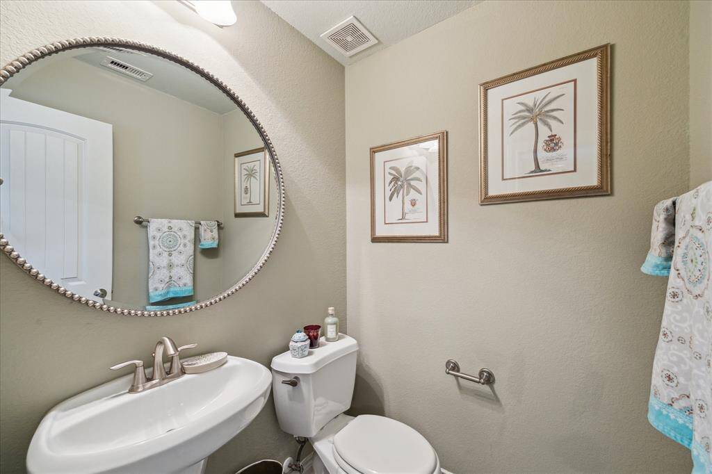 Half bath that services the upstairs theatre room.