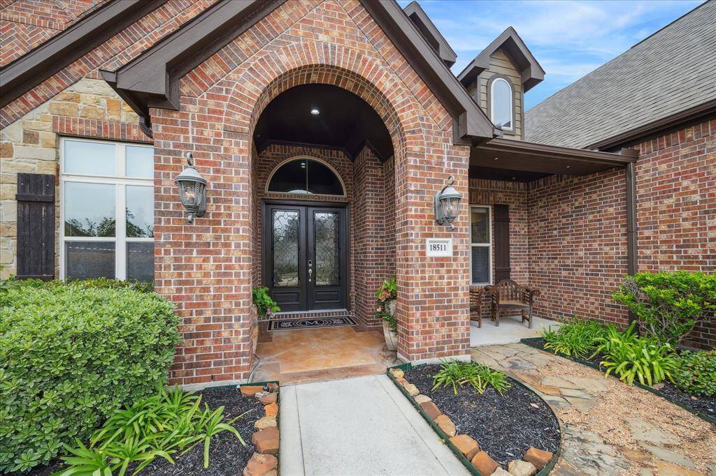 Impressive walk-up with front covered porch and double entry doors