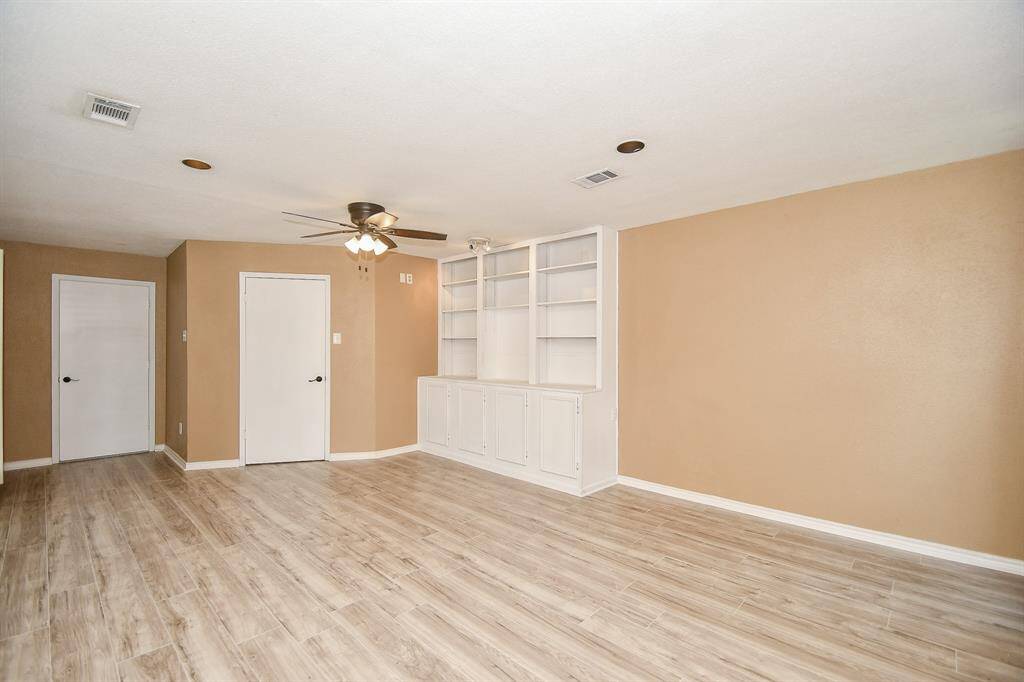 Primary addition has built-in shelves and plenty of space for a sitting area