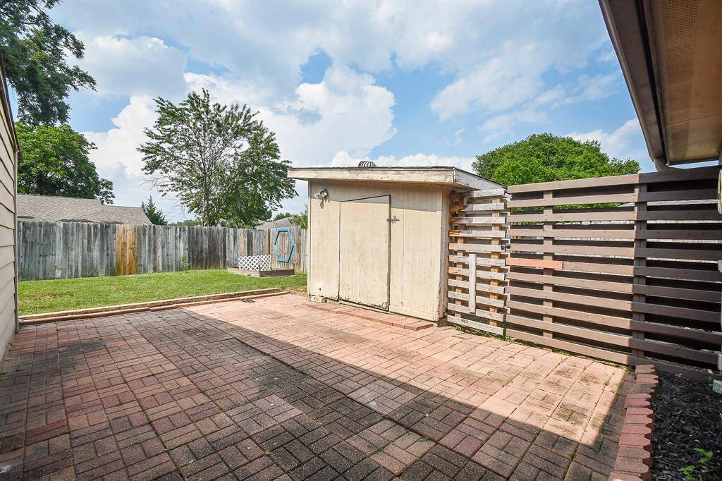 Extended patio with a gated area for a dog or storage.  Great shop, as well for all your tools.