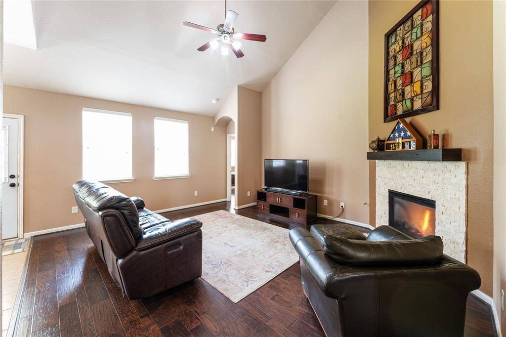 The gas log fireplace adds warmth to the room