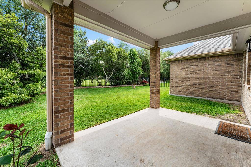 The covered patio has views of the green space - no back neighbors!
